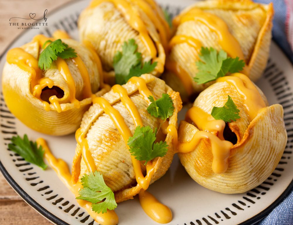 Air Fryer Taco Stuffed Shells recipe features seasoned ground beef and ooey-soft-centered cheese melted inside of slightly crisp air-fried shells.