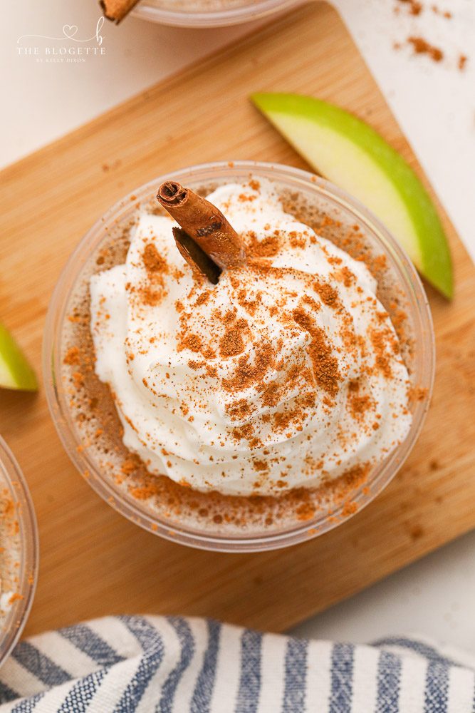 Apple Pie Jello Shots made with Fireball! Topped with whipped cream, this festive jello shot is well-balanced for the holidays or any fall gathering!