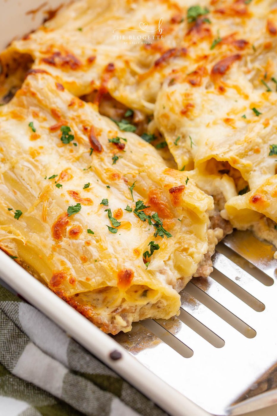 Baked Cannelloni are large pasta shells stuffed with sausage, mushrooms, and cheese, then covered in a creamy sauce!