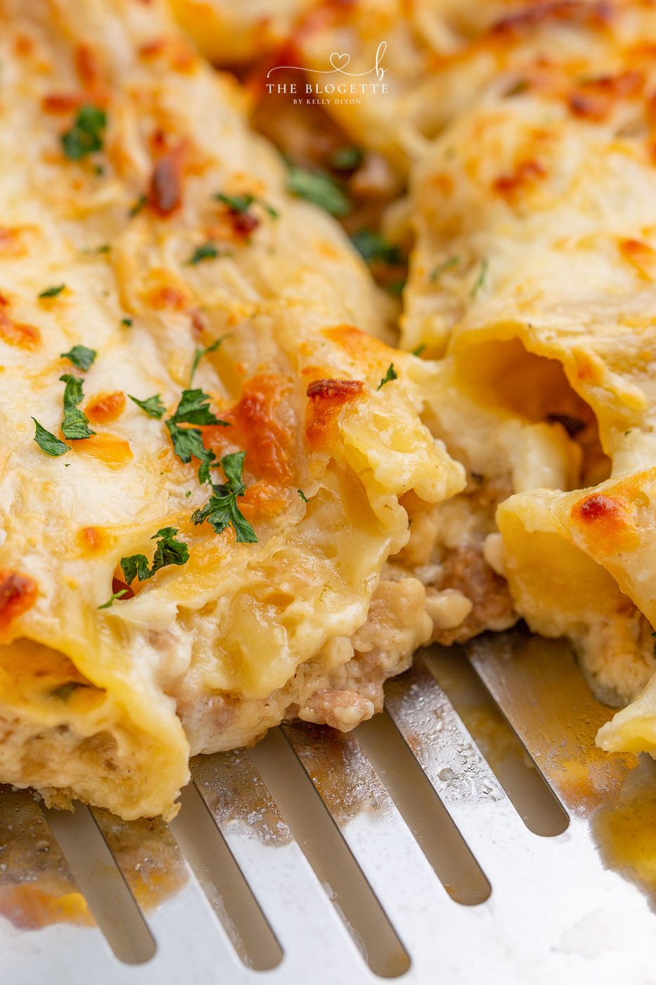 Baked Cannelloni are large pasta shells stuffed with sausage, mushrooms, and cheese, then covered in a creamy sauce!
