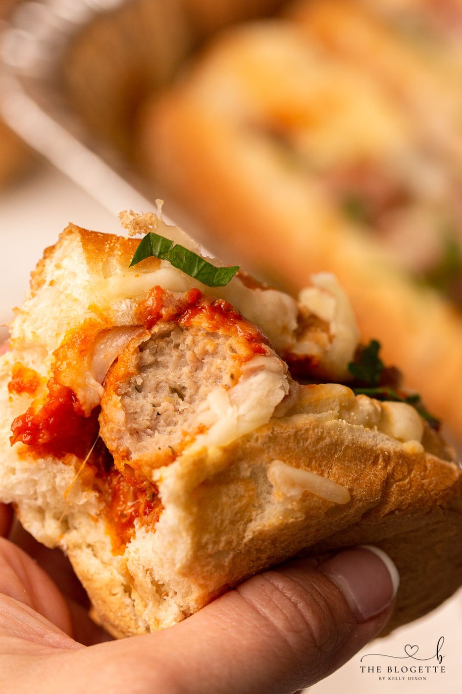 Baked Meatball Subs are packed with lots of melty cheese! Everyone loves this straightforward dinner. Baked with meatballs in a satisfying marinara sauce and bubbly cheese on top.
