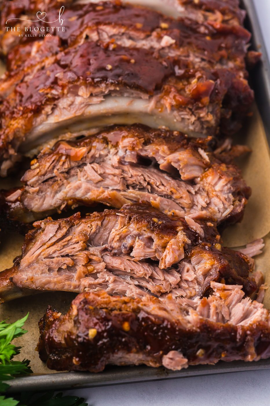 Baked Ribs - Tender ribs seasoned with a bold, flavorful sauce are baked in the oven until the meat is fall-off-the-bone. Comfort on a plate!