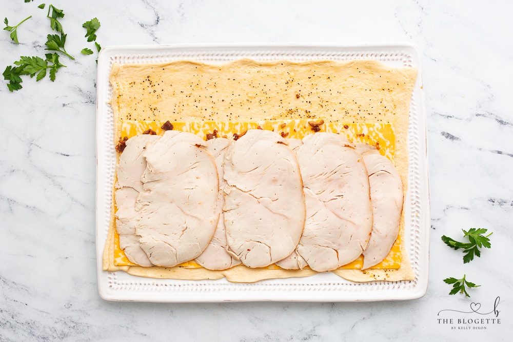 Bacon, cheese, and turkey on crescent dough