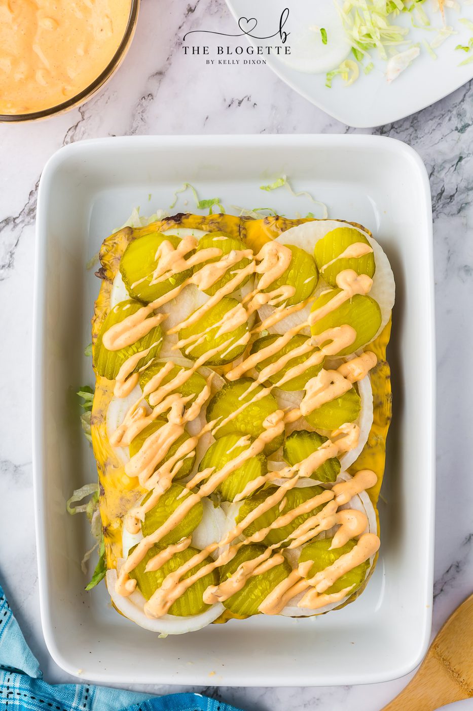 Pickles and sauce drizzle