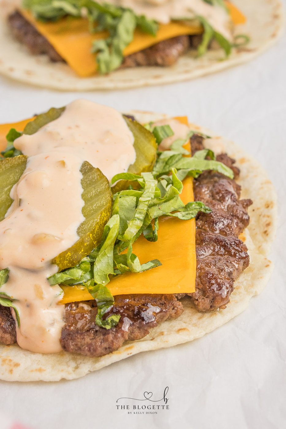 stacked burger Tacos! Juicy beef patty, melted cheddar, topped with an straightforward-to-make from-scratch stacked burger sauce! Add Taco Burgers to your menu tonight!