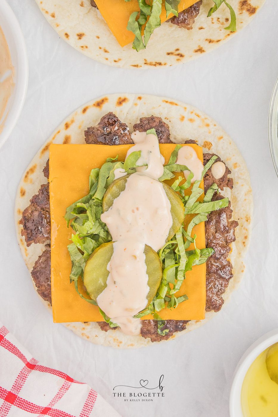 stacked burger Tacos! Juicy beef patty, melted cheddar, topped with an straightforward-to-make from-scratch stacked burger sauce! Add Taco Burgers to your menu tonight!