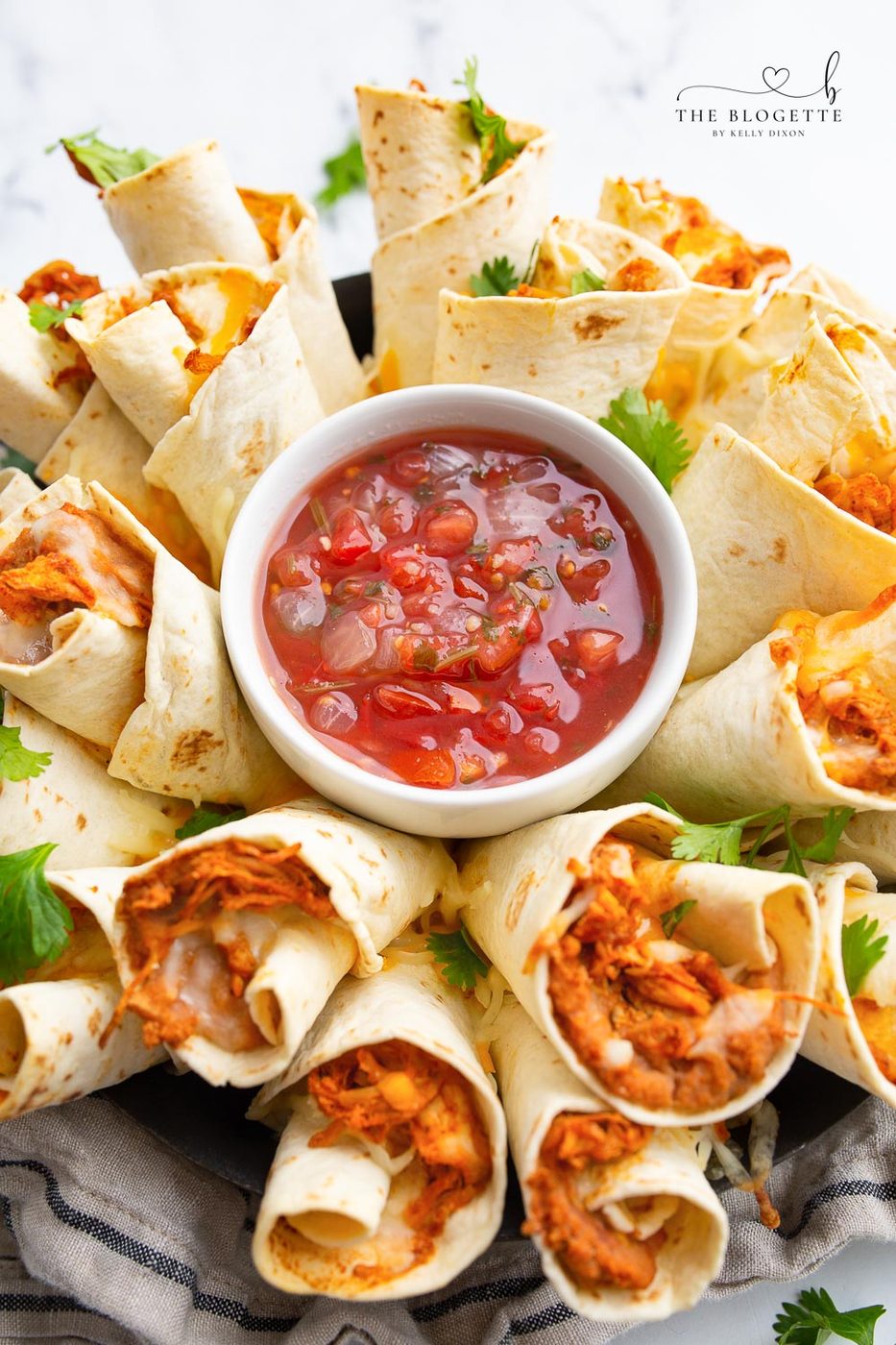 A Blooming Burrito Ring is the well-balanced appetizer for any occasion! A round display of chicken and bean burritos served with a bowl of dip.