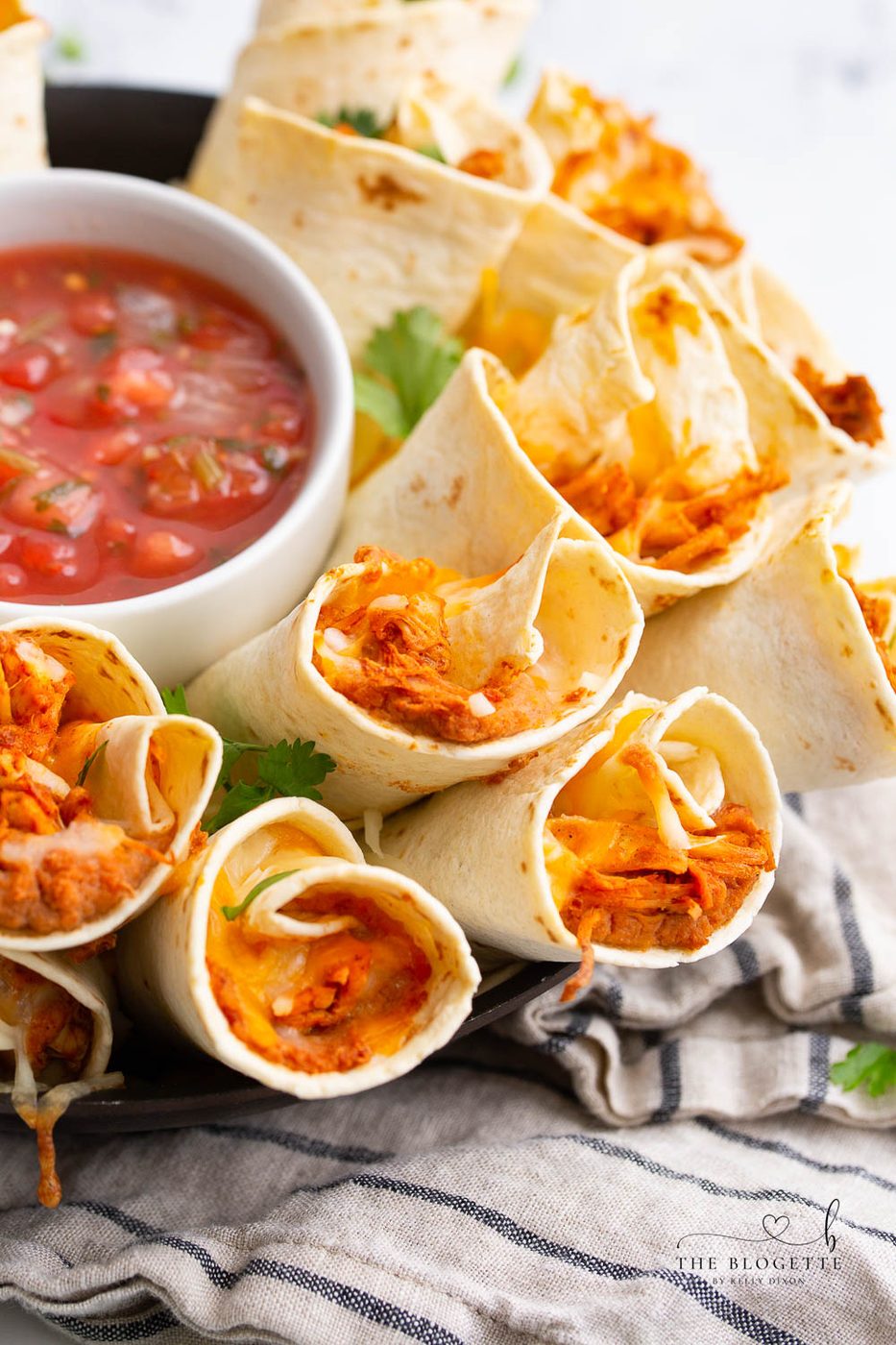 A Blooming Burrito Ring is the well-balanced appetizer for any occasion! A round display of chicken and bean burritos served with a bowl of dip.