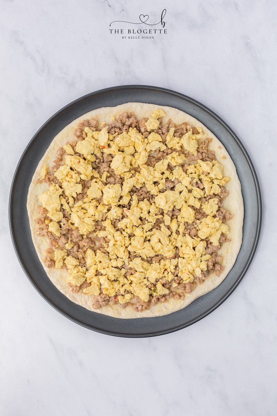 Layer with eggs, sausage, bacon, and cheese.