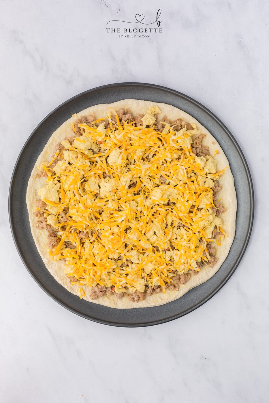 Layer with eggs, sausage, bacon, and cheese.