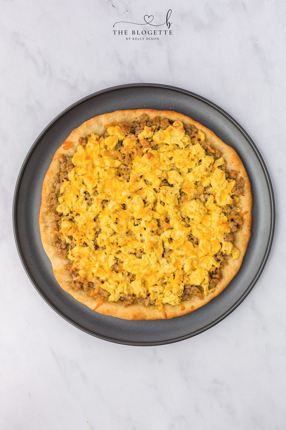 Layer with eggs, sausage, bacon, and cheese.