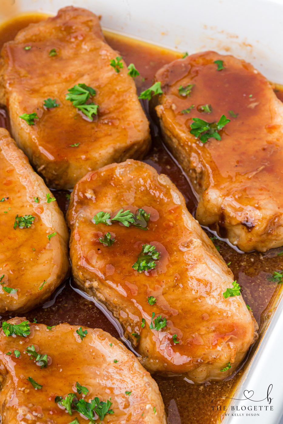 These Brown Sugar Pork Chops are coated in a rich, buttery, sweet-and-savory glaze that bakes into juicy perfection. Straightforward weeknight recipe with oven and slow-cooker options! Save this family-favorite pork chop idea for dinner tonight.