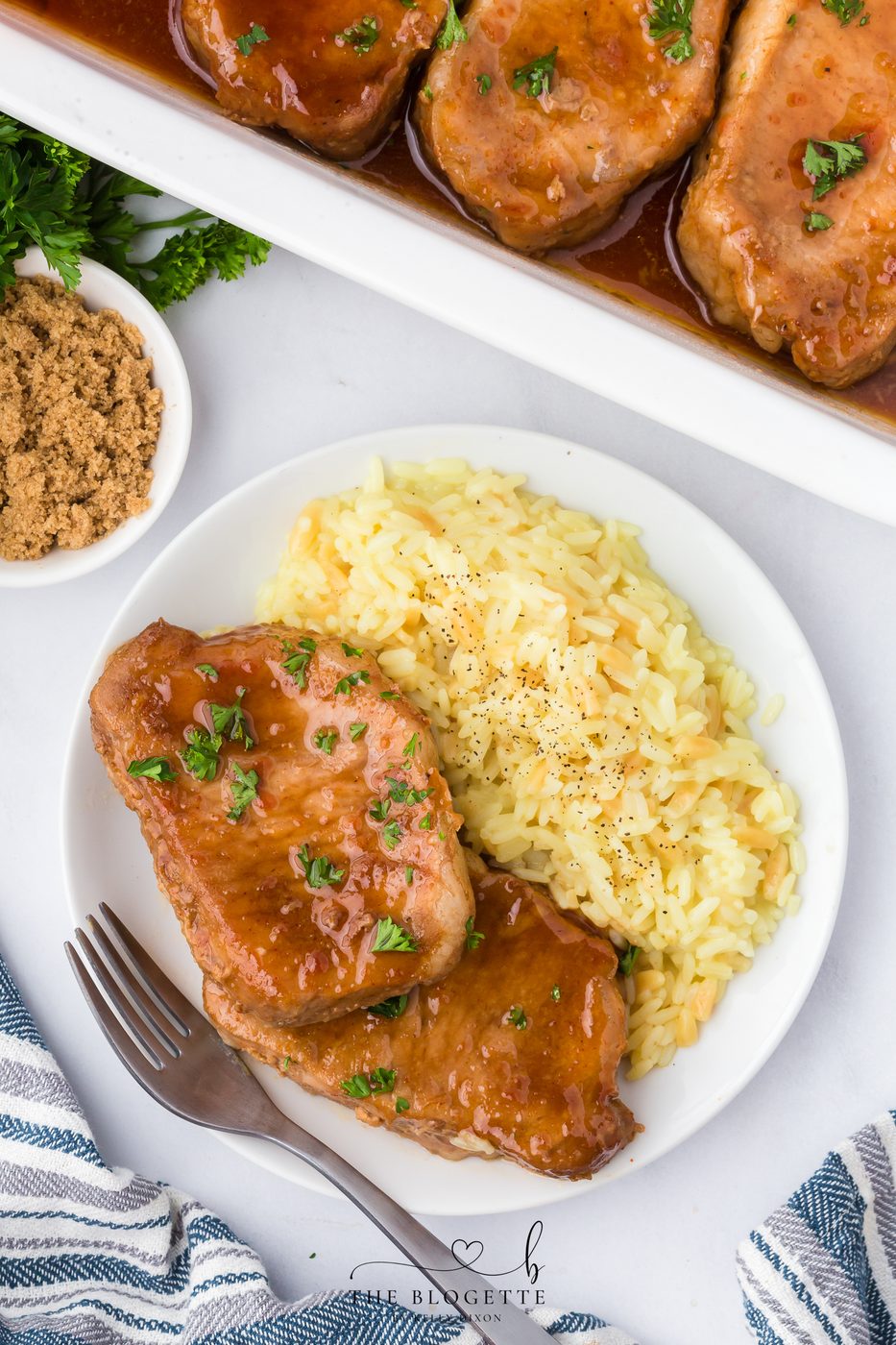 These Brown Sugar Pork Chops are coated in a rich, buttery, sweet-and-savory glaze that bakes into juicy perfection. Straightforward weeknight recipe with oven and slow-cooker options! Save this family-favorite pork chop idea for dinner tonight.