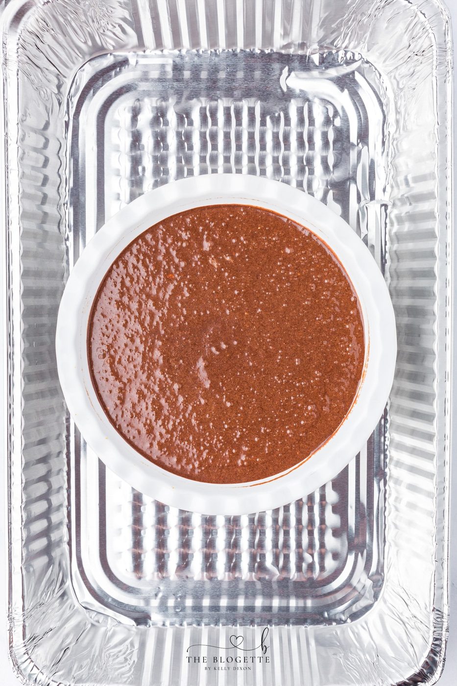 Place the pie pan inside a larger baking dish