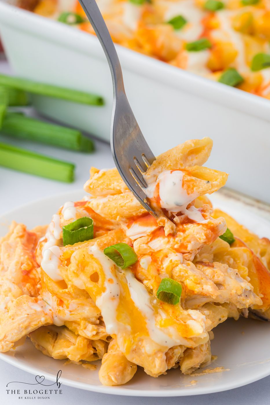 Buffalo Chicken Pasta Bake - Creamy, spicy, and loaded with melty cheese. The well-balanced weeknight meal that comes together in under an hour.