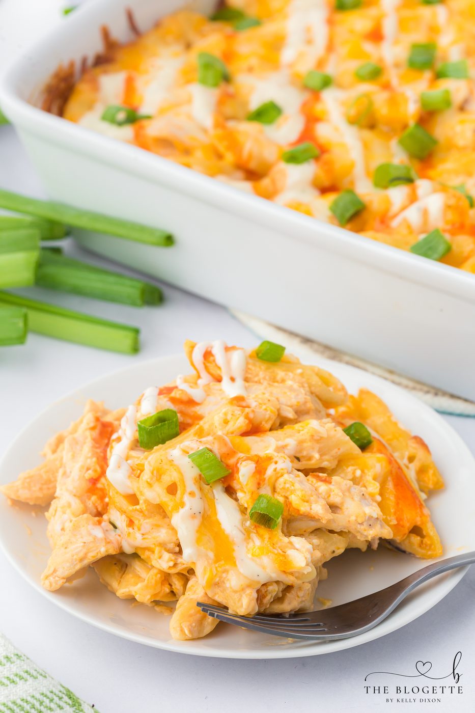 Buffalo Chicken Pasta Bake - Creamy, spicy, and loaded with melty cheese. The well-balanced weeknight meal that comes together in under an hour.