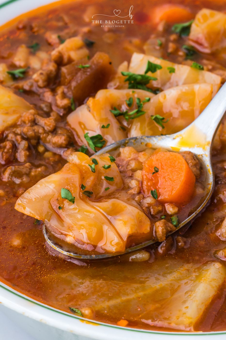 Hearty cabbage soup with ground beef, tender cabbage, tomatoes, and rice simmered in a rich broth.