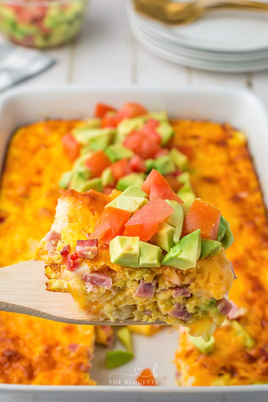 California Breakfast Casserole is loaded with cheese, hash browns, and ham. Topped with satisfying avocados and tomatoes.
