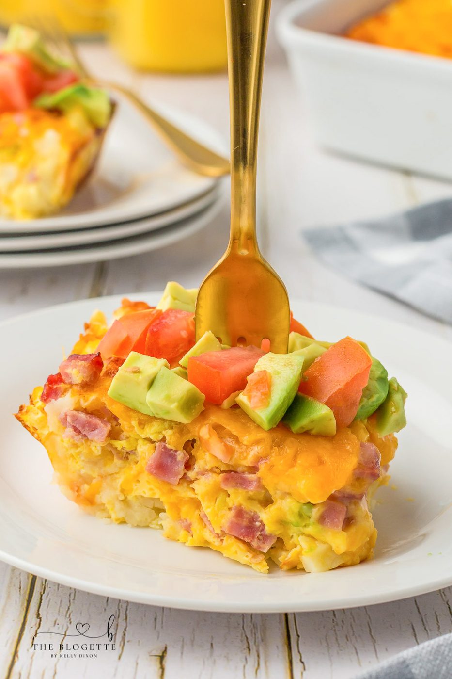 California Breakfast Casserole is loaded with cheese, hash browns, and ham. Topped with satisfying avocados and tomatoes.