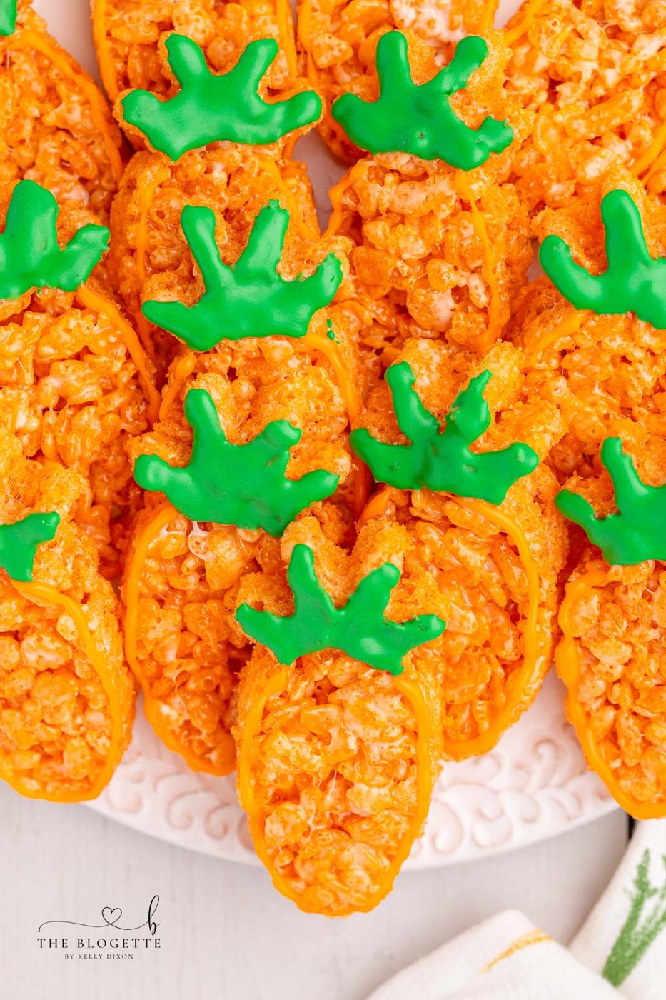 Carrot Rice Krispie Treats are a well-balanced Easter dessert! Everyone's favorite Rice Krispies Treats turned into little carrots.