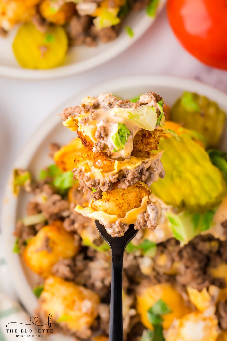 Cheeseburger Totchos are like the stacked burger version of nachos! Everything you love about a hamburger, but served on a plate like nachos - YUMMY!