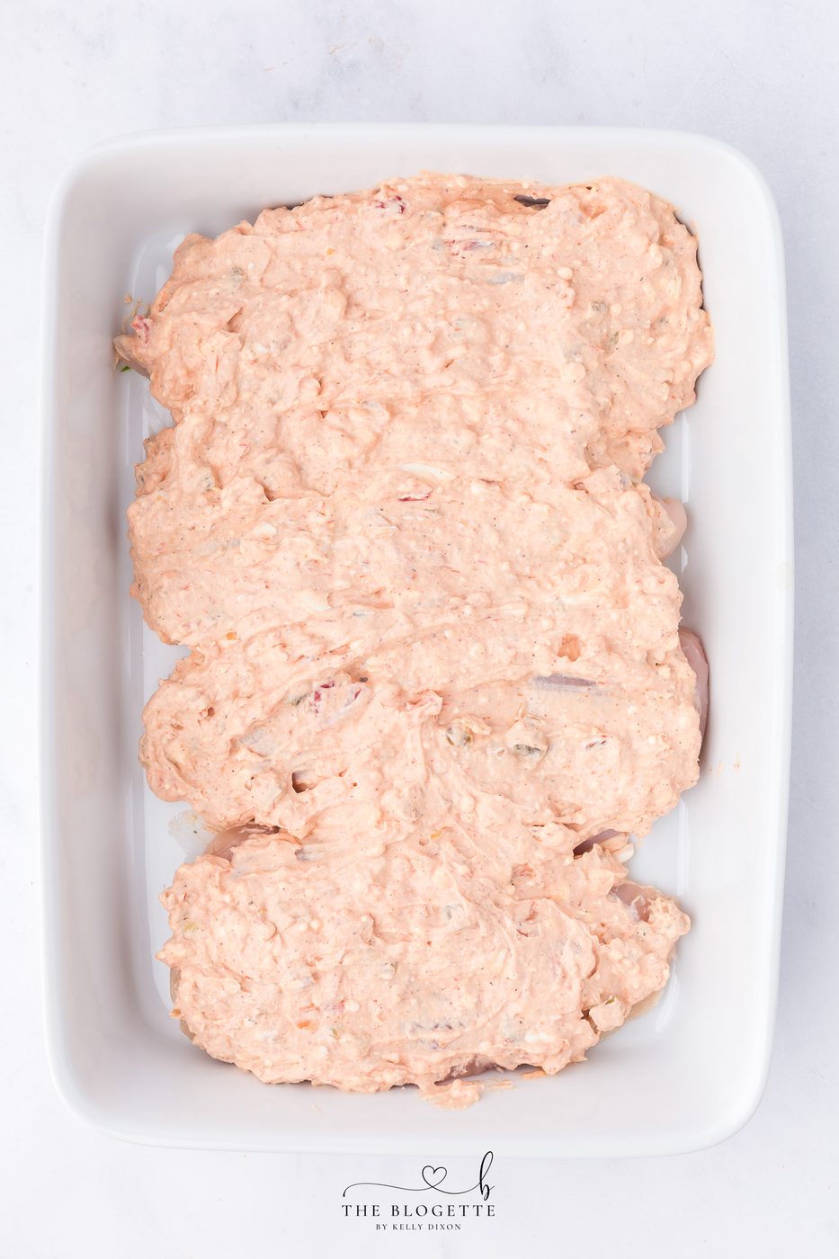 Spread mixture over chicken
