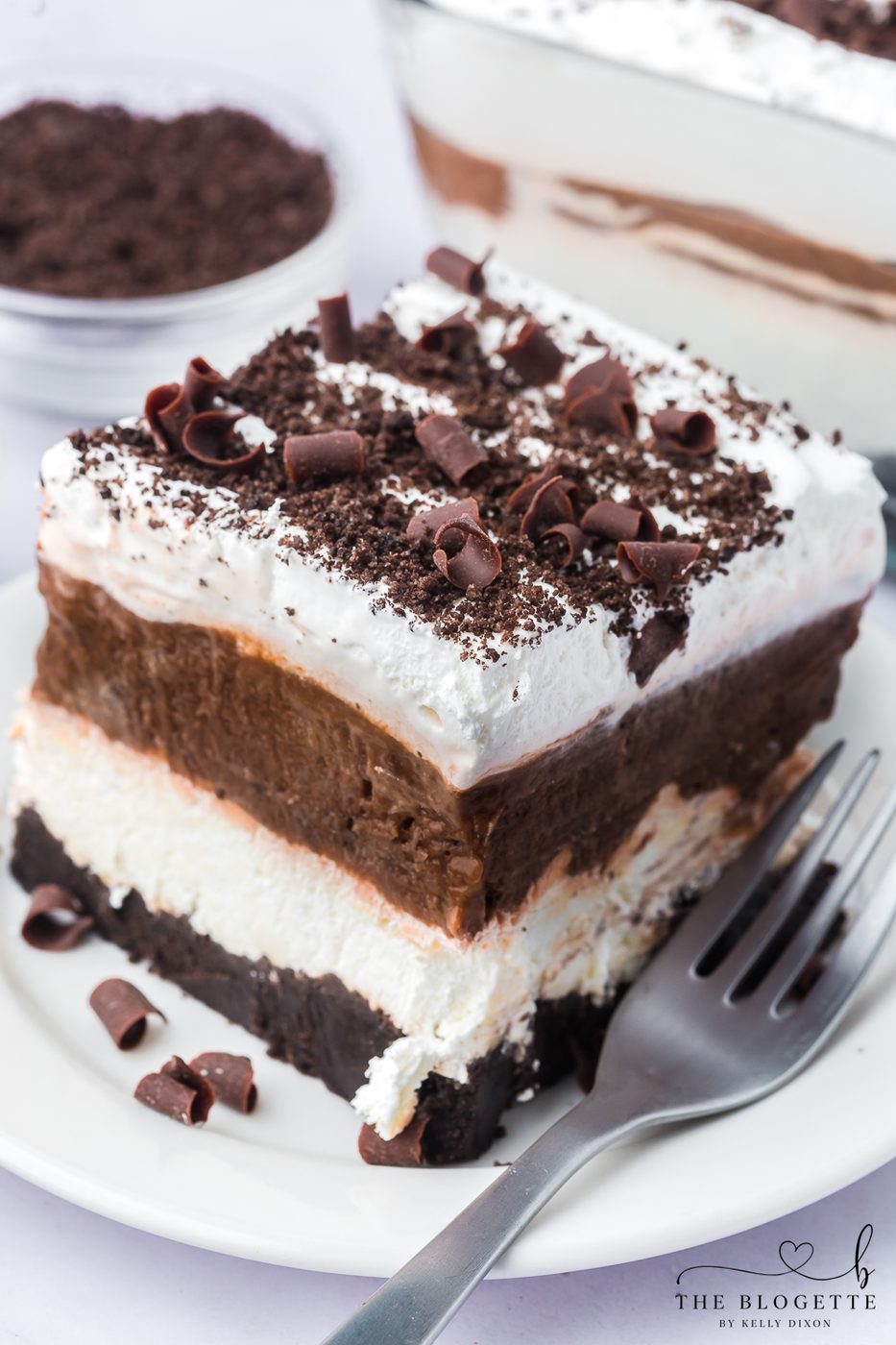 Chocolate Lasagna has layers of rich chocolate pudding, creamy cream cheese filling, and whipped topping with an Oreo crust.