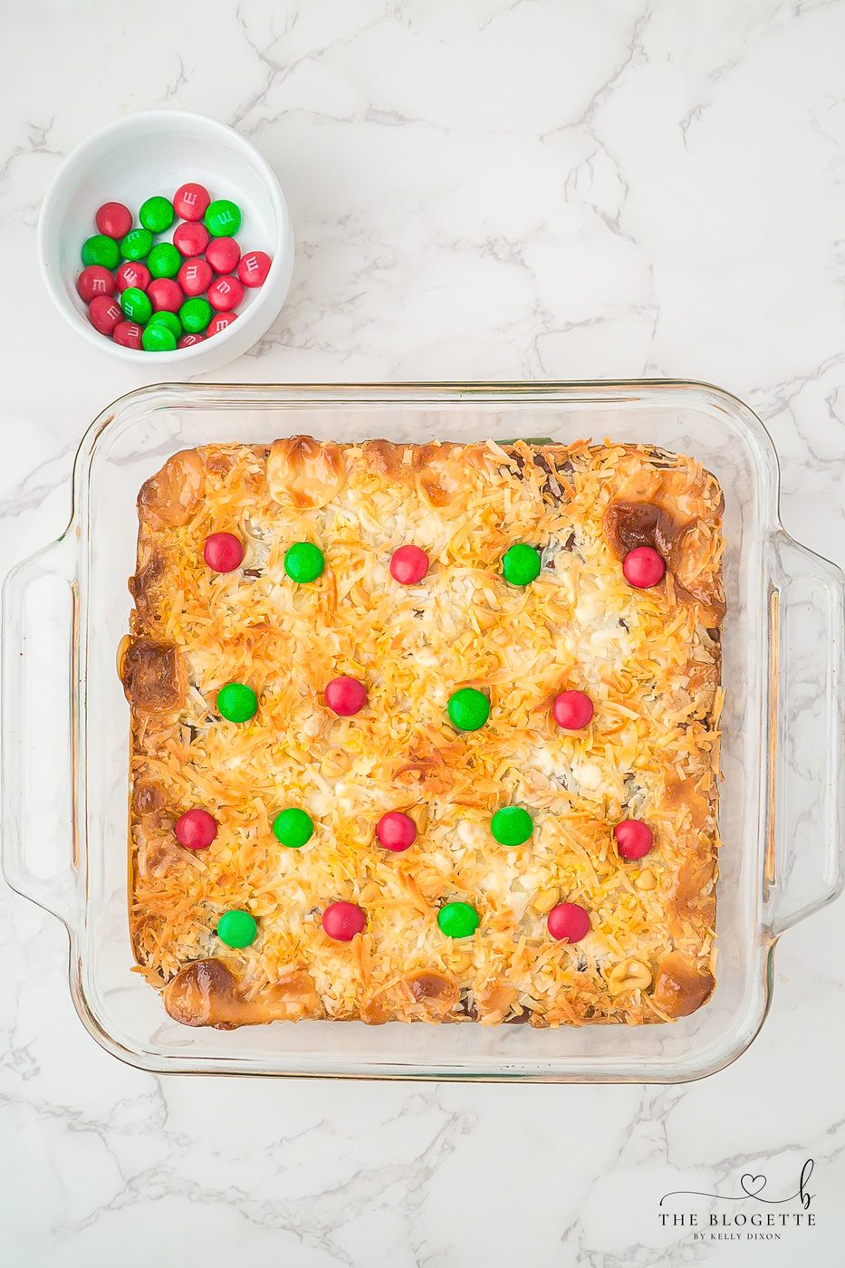 press the holiday colored M&M’s into rows on top of the bars