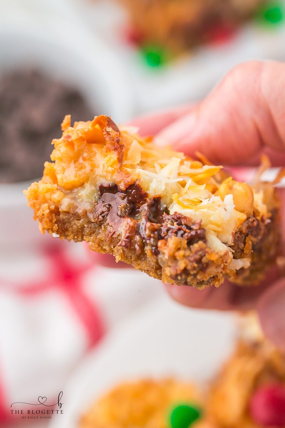 Straightforward Christmas Magic Bars made with graham crackers, sweetened condensed milk, chocolate chips, coconut, and festive M&M’s. A speedy holiday dessert everyone loves!