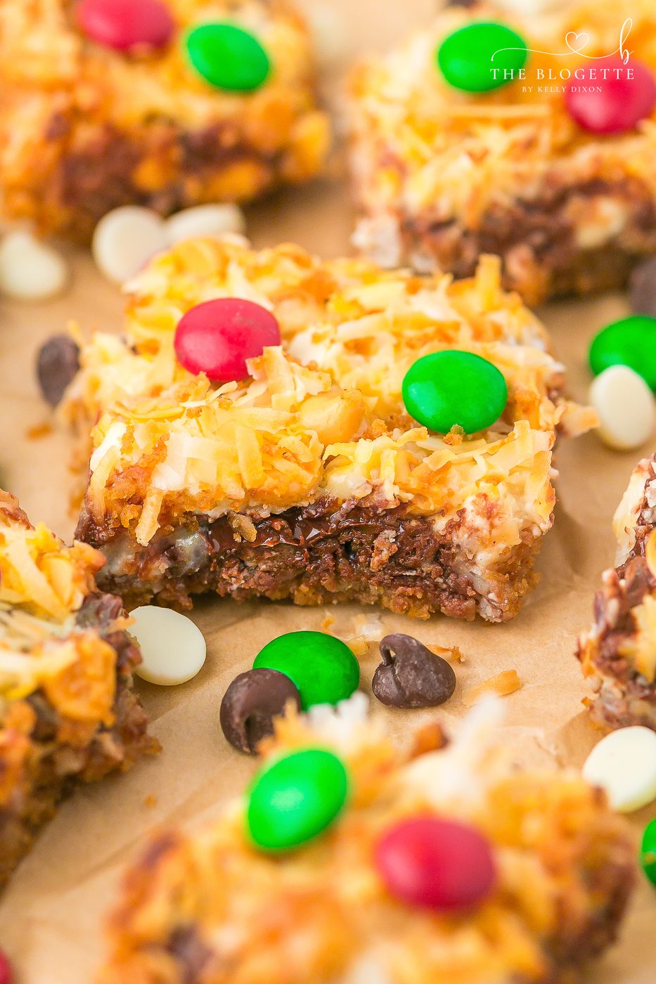 Straightforward Christmas Magic Bars made with graham crackers, sweetened condensed milk, chocolate chips, coconut, and festive M&M’s. A speedy holiday dessert everyone loves!