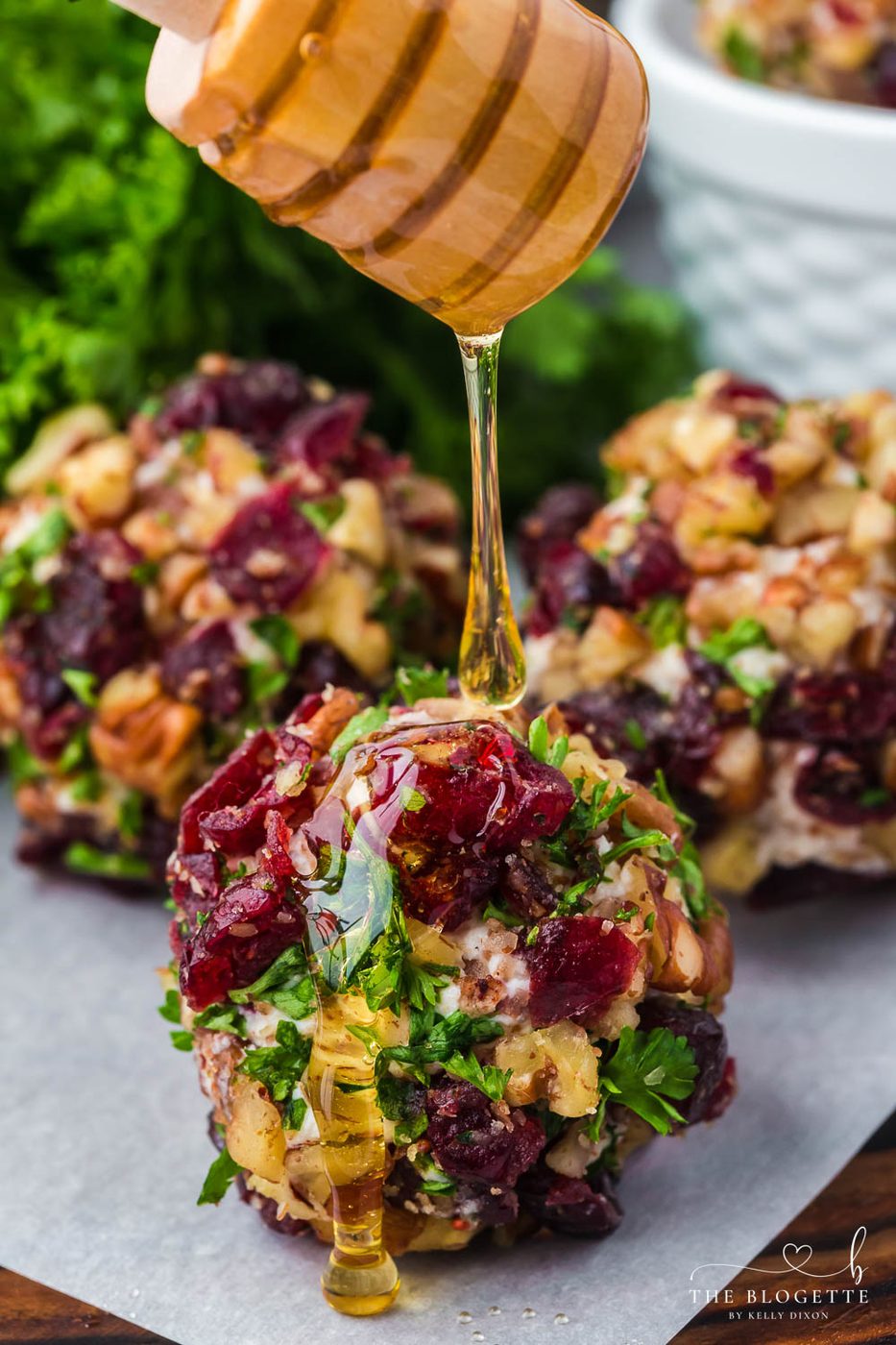 Cranberry Pecan Goat Cheese Balls are festive mini cheese truffles loaded with creamy goat cheese, sweet cranberries, and crisp pecans!