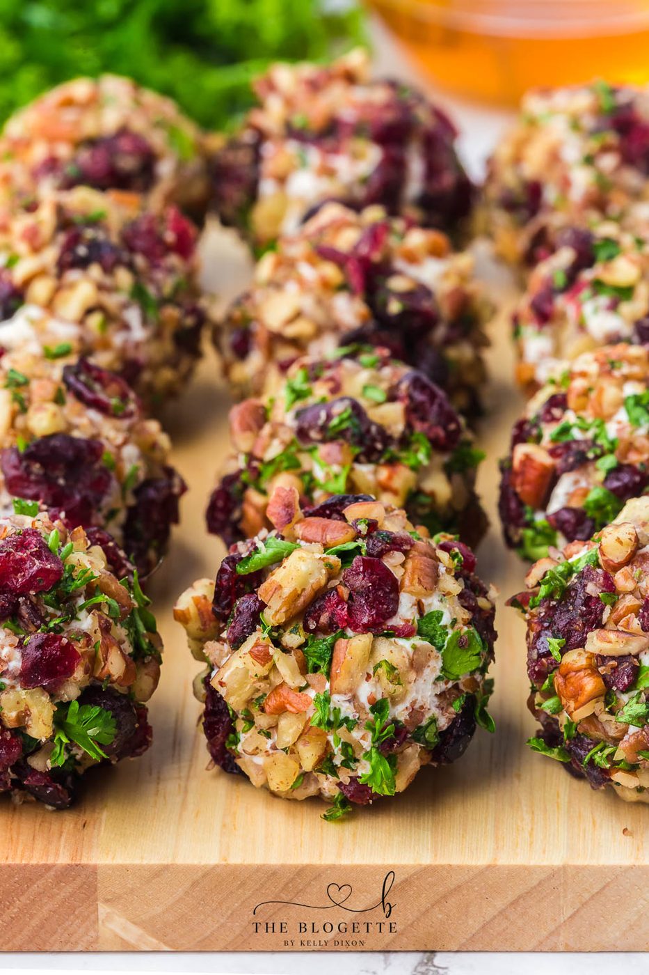 Cranberry Pecan Goat Cheese Balls are festive mini cheese truffles loaded with creamy goat cheese, sweet cranberries, and crisp pecans!