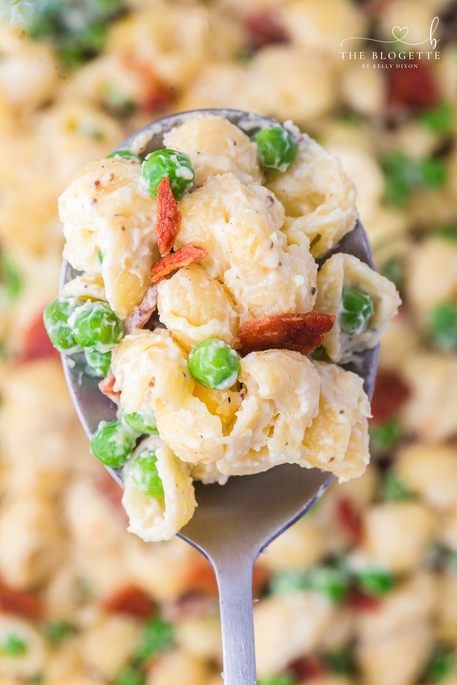 Our favorite Creamy Pasta Salad recipe - with bacon, peas, and a rich, tangy dressing. A side dish that disappears fast! Always requested recipe!