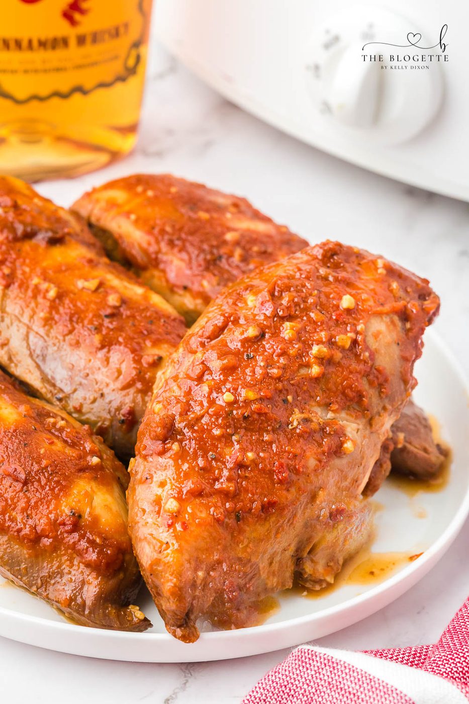 Slow-cooker Fireball Chicken - a flavorful slow cooker chicken seasoned with a from-scratch Fireball-flavored sauce! The whiskey sauce makes the chicken so juicy and satisfying.