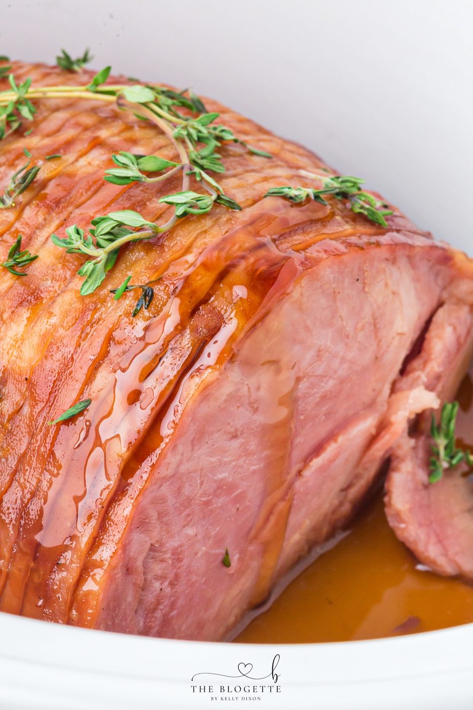 Make tender Slow-cooker Ham with a maple brown sugar glaze, pineapple juice, butter, and thyme. An straightforward holiday ham recipe made in the slow cooker!