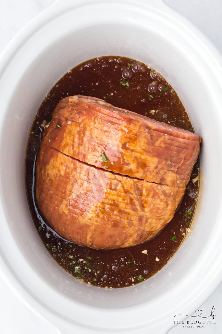 Add sauce over ham in slow-cooker