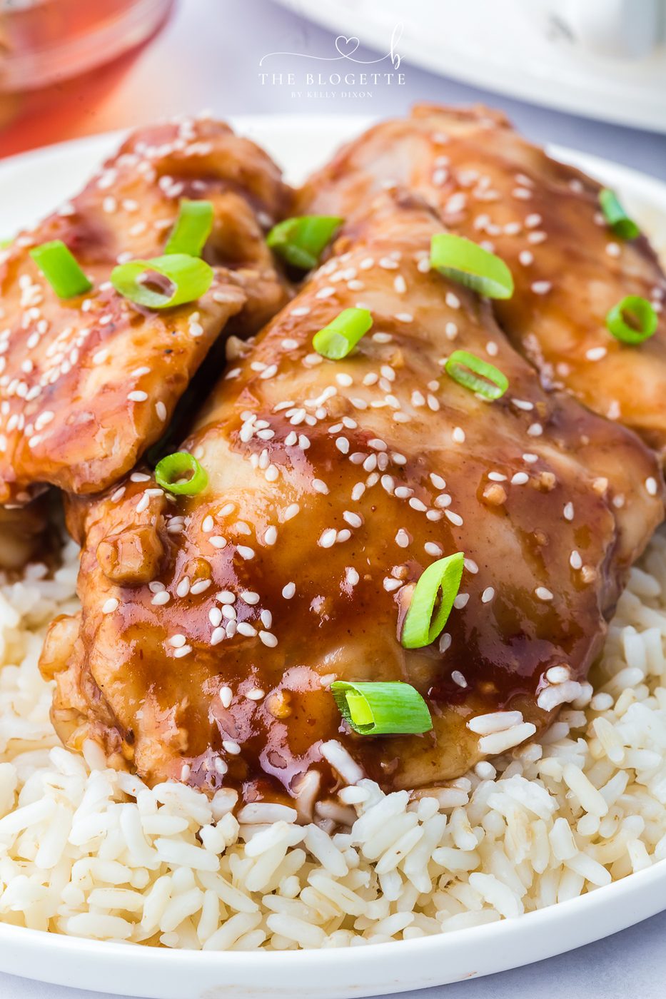 Crockpot Honey Garlic Chicken Recipe! Tender chicken thighs in a sweet and sticky sauce with a kick of heat.