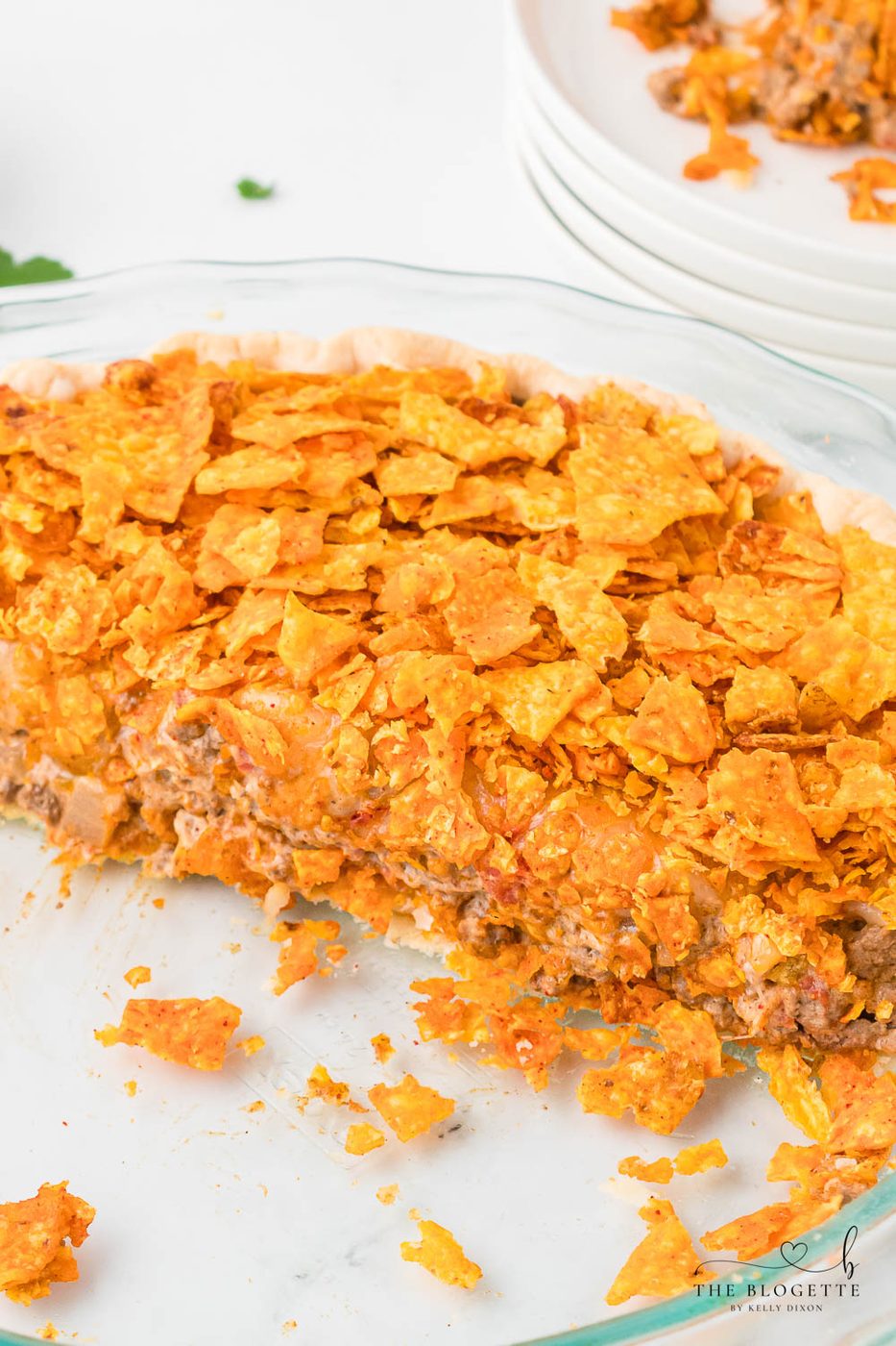 This Straightforward Dorito Pie Recipe is made with a pie crust, ground beef, Cool Ranch or Nacho Cheese Doritos, and a creamy cheese sauce!
