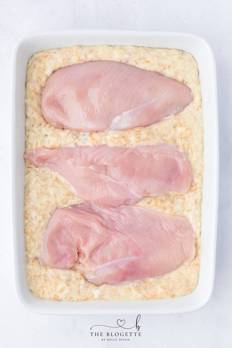 Place the chicken breasts directly on top of the rice mixture.