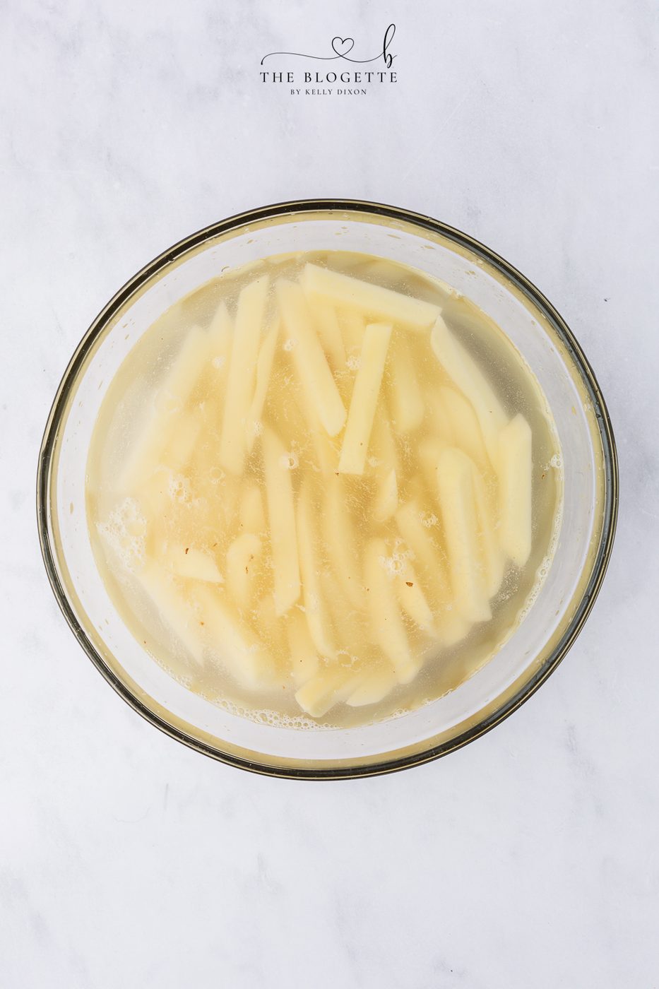 place the potato slices in a large bowl