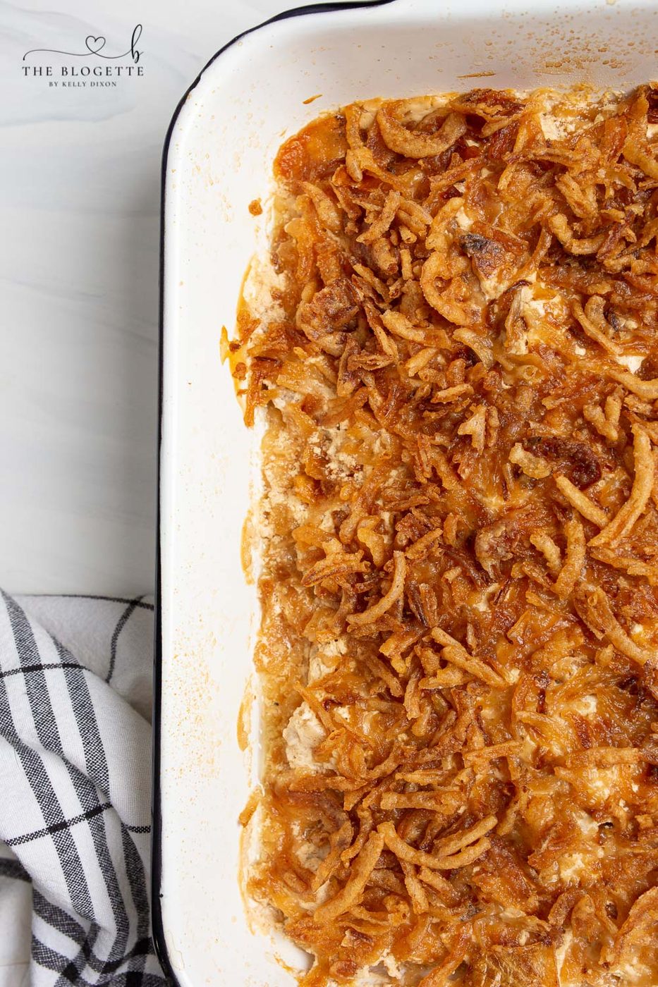 Pork Chop Casserole is easily made with pork chops smothered in an addicting creamy sauce and topped with everyone's favorite crispy fried onions! Whether a holiday dish or a comforting weeknight meal, you and your family will love this. Add it to your menu now!