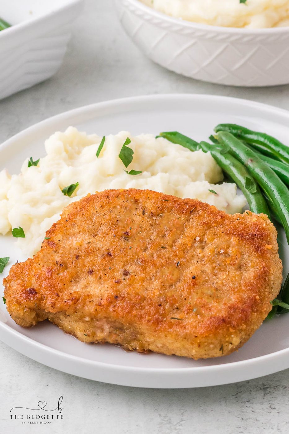Breaded Fried Pork Chops cooked to crispy perfection! Golden brown boneless pork chops are crispy on the outside and juicy on the inside.