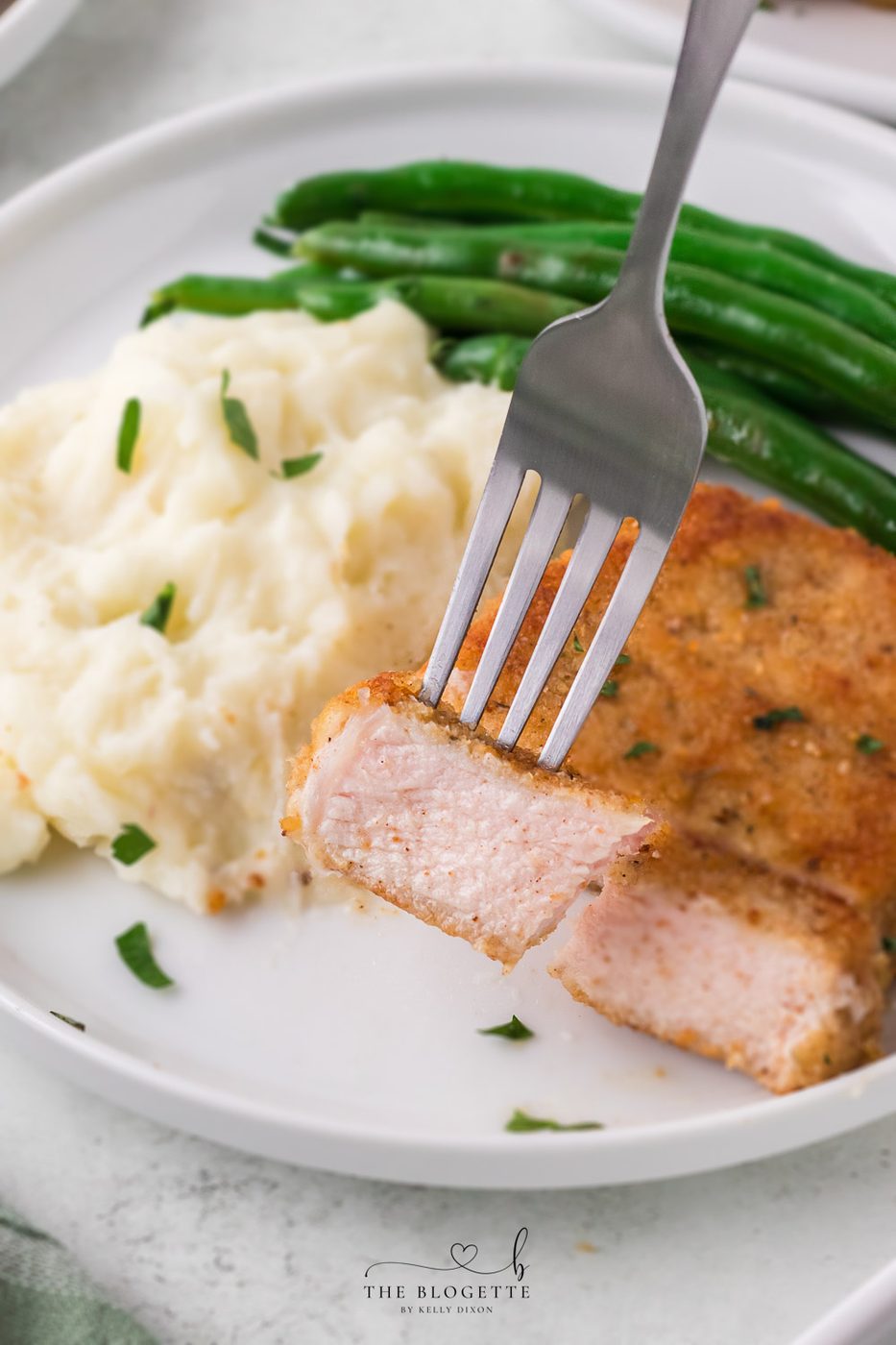Breaded Fried Pork Chops cooked to crispy perfection! Golden brown boneless pork chops are crispy on the outside and juicy on the inside.