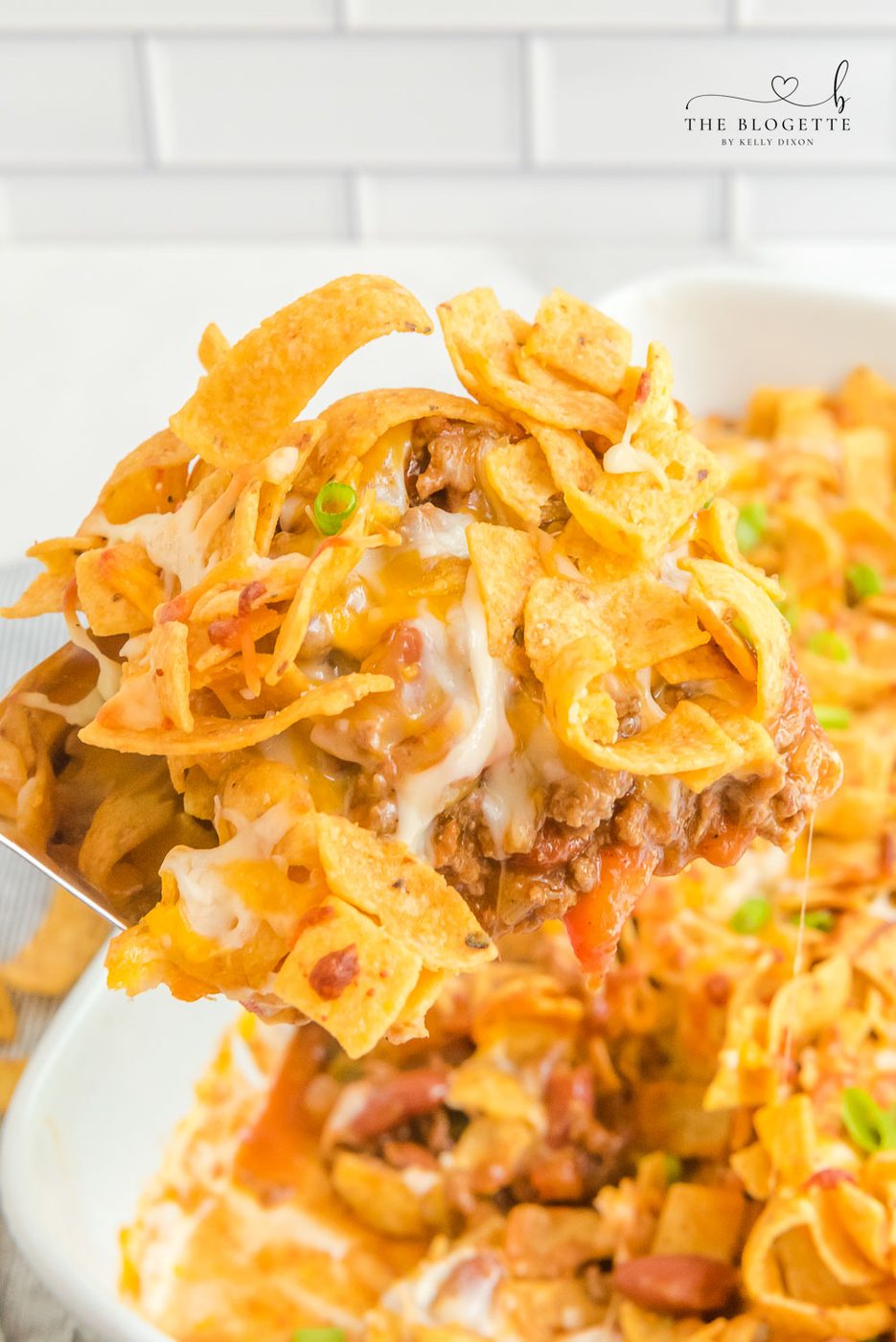 Frito Pie is a casserole made with ingredients like ground beef, taco seasoning, cheese, & Fritos. This can also make Walking Tacos!