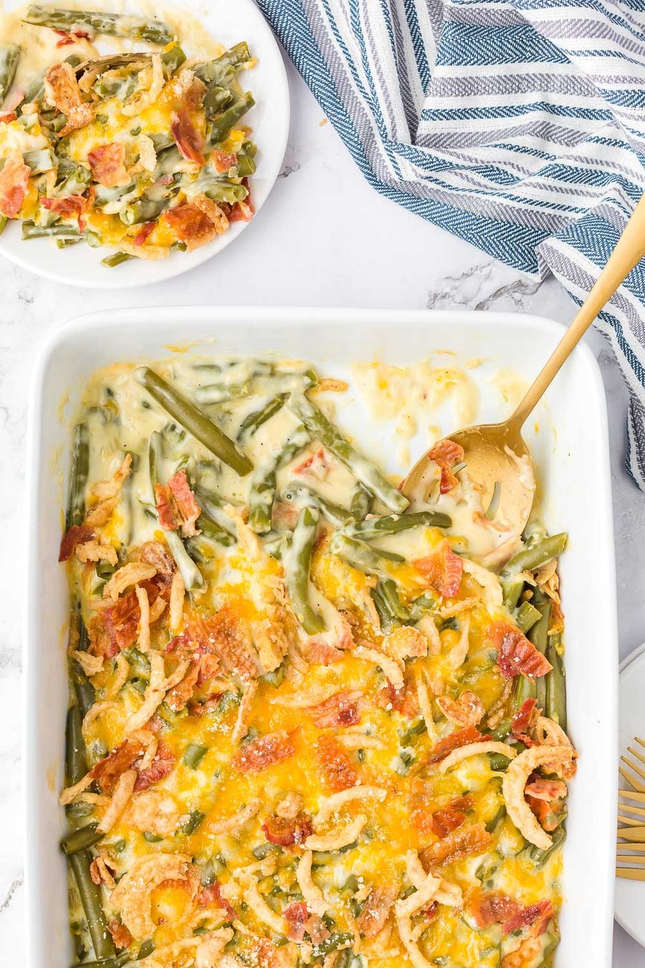 A creamy and Cheesy Green Bean Casserole with Bacon will be a hit on your holiday table. A must-have recipe for Thanksgiving and Christmas!