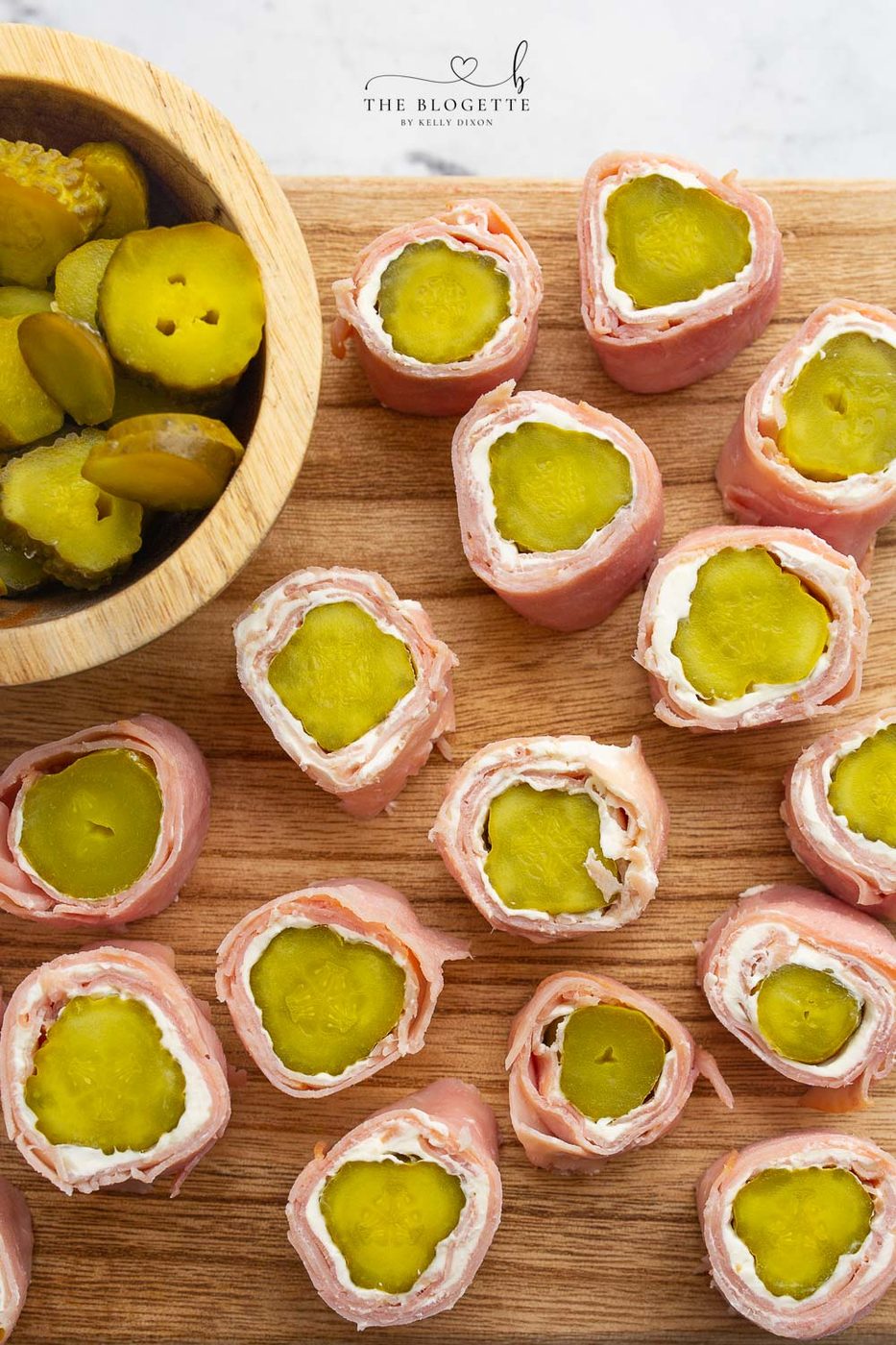 Ham and Pickle Roll Ups are one of our favorite appetizers ever! Ham, cream cheese, and pickles rolled up into a tasty straightforward appetizer.