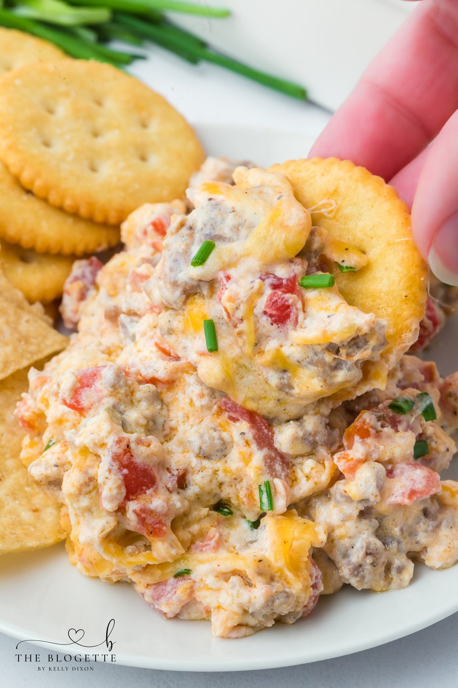 Hissy Fit Dip is the ultimate cheese and sausage dip loaded with cream cheese, Rotel, and melty shredded cheese. This straightforward appetizer recipe is well-balanced for game day, parties, and holidays.