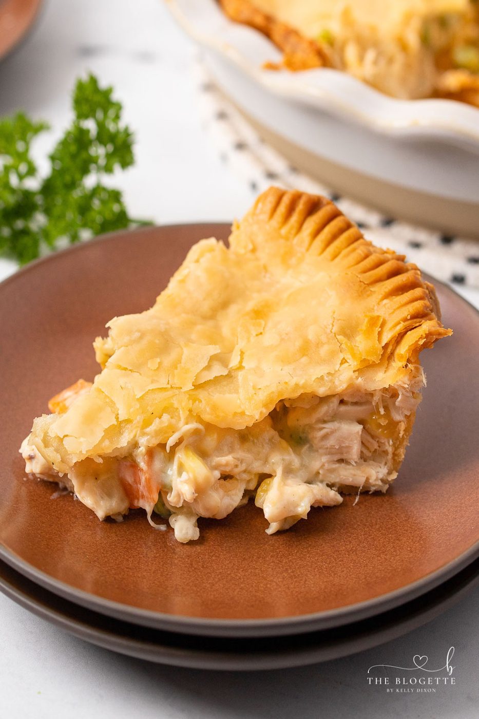 One of the most popular comfort food meals of all time, this From-scratch Chicken Pot Pie has a flaky, buttery crust, a creamy sauce, and a deliciously filling mix of chicken and vegetables.
