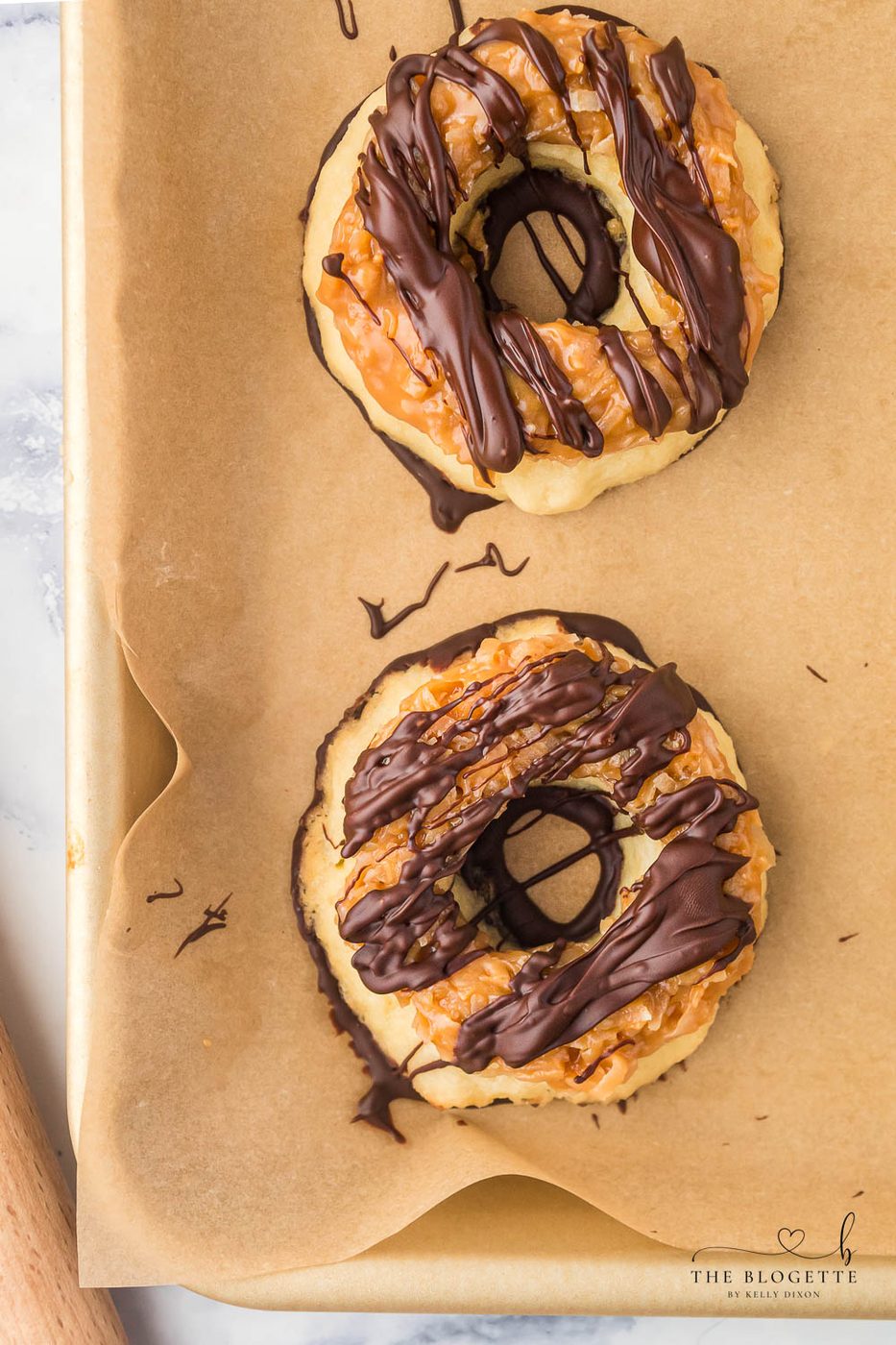 From-scratch Samoa Cookies are a at-home version of everyone's favorite Girl Scout Cookie! These big, thick, and buttery shortbread cookies melt in your mouth and are packed with chocolate, caramel, and coconut.