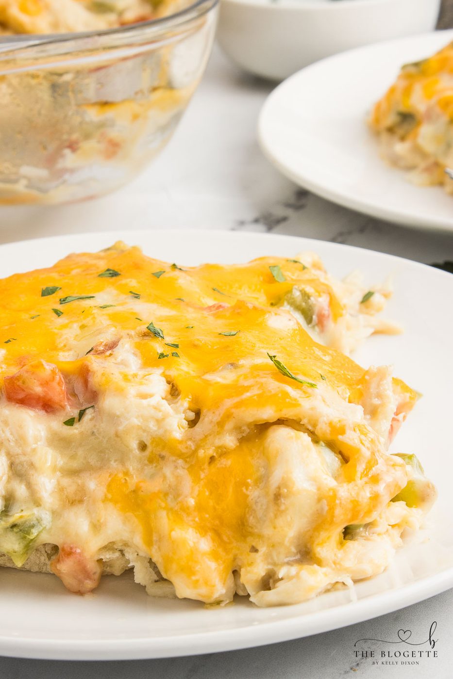King Ranch Chicken Casserole is a combination of chicken, cheese, veggies, and corn tortillas in a rich and creamy sauce.